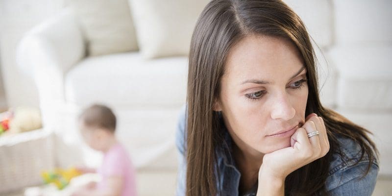 Mother with daughter (6-11 months) in living room